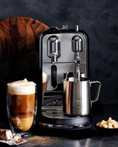 Breville Nespresso Creatista Plus brewing coffee and frothing milk