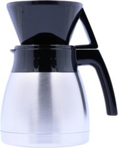 Melitta pour-over coffee maker with paper filter and fresh grounds