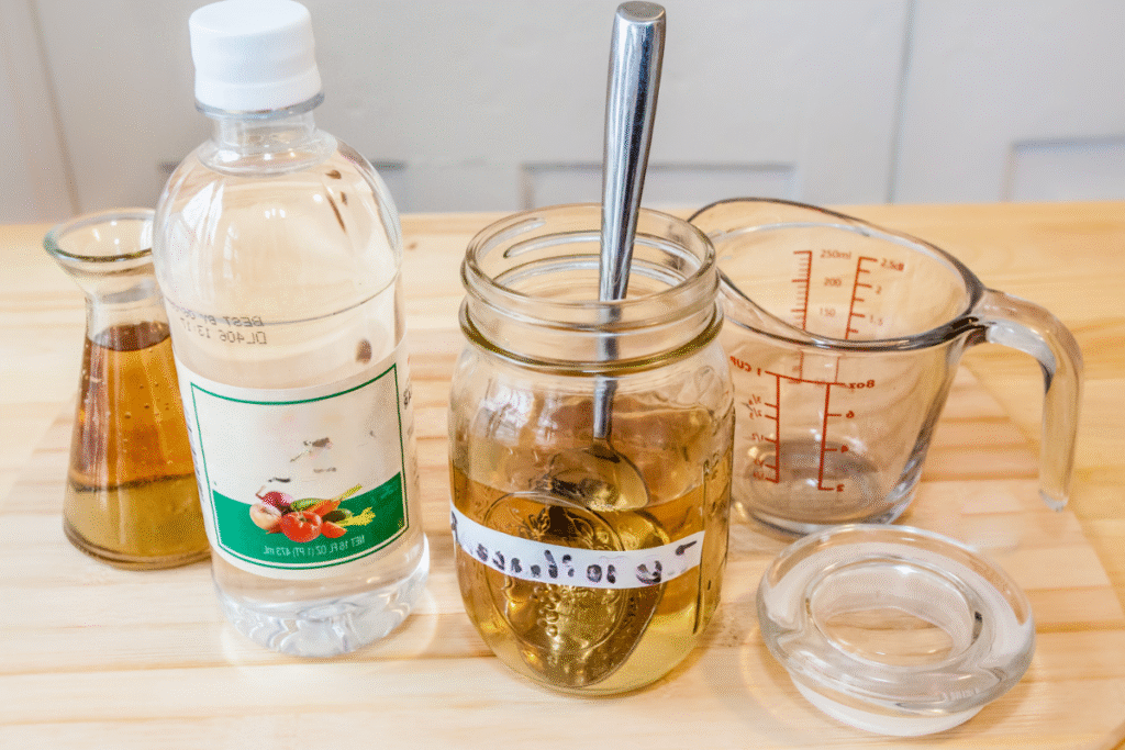 Preparing a homemade descaling solution with white vinegar and water for the coffee maker