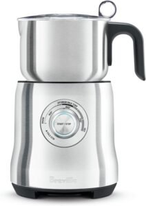 "A brushed stainless steel milk frother from Breville, known as the Milk Café Frother BMF600XL. It features multiple temperature settings and a large capacity for frothing milk for various coffee beverages."