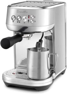 "A compact brushed stainless steel espresso machine designed for home use. It features a fast heat-up time, automatic milk frother, and preset espresso shot buttons.""A compact brushed stainless steel espresso machine designed for home use. It features a fast heat-up time, automatic milk frother, and preset espresso shot buttons."