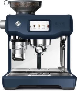 "A luxurious automatic espresso machine in Damson Blue by Breville, known as the Oracle Touch. It features an integrated grinder, automatic milk frother, and a touchscreen interface for easy customization of espresso drinks."