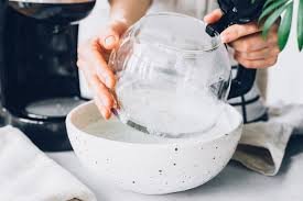 Descaling pour-over coffee maker with vinegar solution