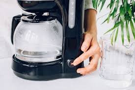 Measuring cup with vinegar and water mix
