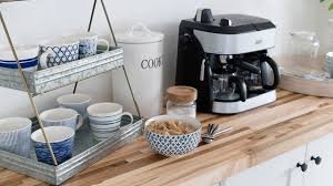 Cold brew coffee maker with coffee beans and a clean setup.