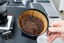 Ground coffee in a filter basket of a drip coffee maker