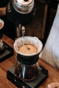 Electric pour-over coffee maker showerhead for even water distribution.