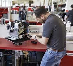 image of a man utilizing the jura coffee maker components 